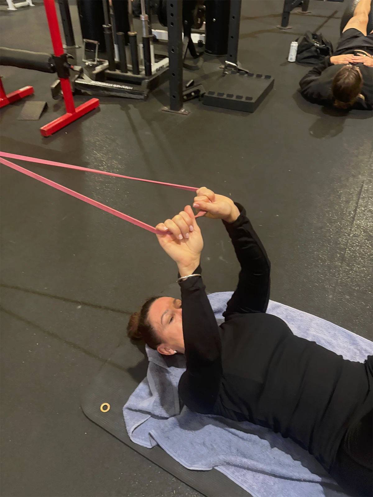 Patient at Sports and Spine Physiotherapy in Brookvale - Northern Beaches doing specific exercises to improve strength and control in neck and shoulder for headache physiotherapy.